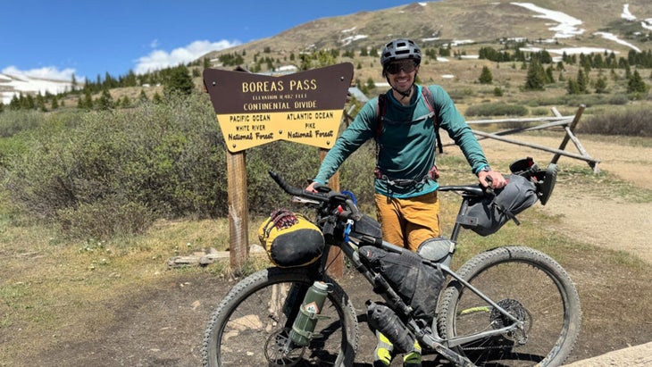 man standing with mountain bike at Continental Divide