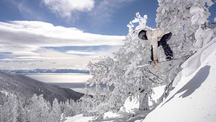 Woman snowboarding on the Gnu Barrett