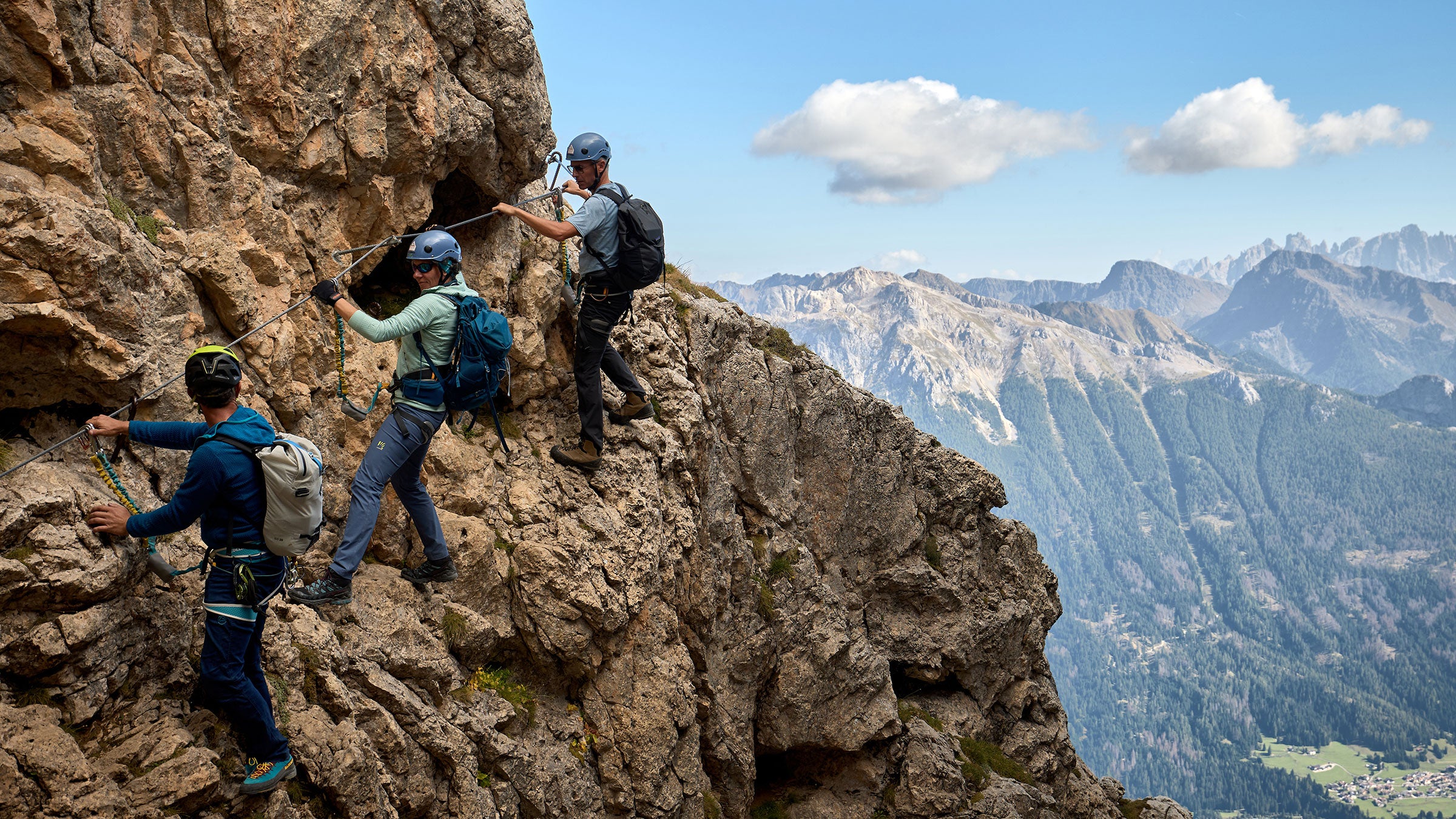 people climbing the roda de vael, one of the classic via ferratas in the Italian Dolomites