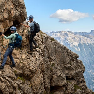people climbing the roda de vael, one of the classic via ferratas in the Italian Dolomites