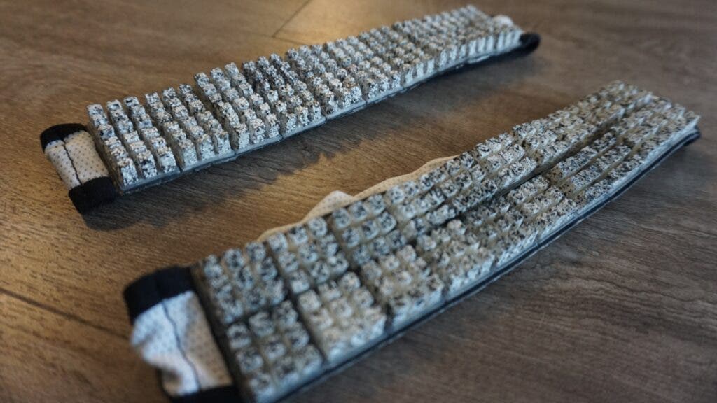 A real Omius cooling headband sits on a table next to the study's placebo headband