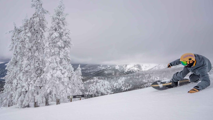 A man snowboarding