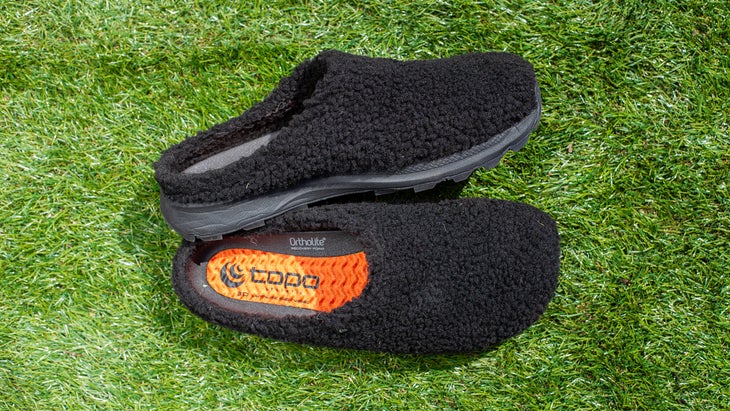 Topo Athletic recovery footwear on grass