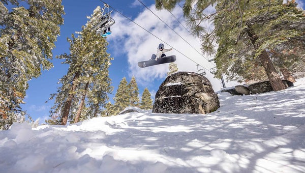 A woman snowboarding