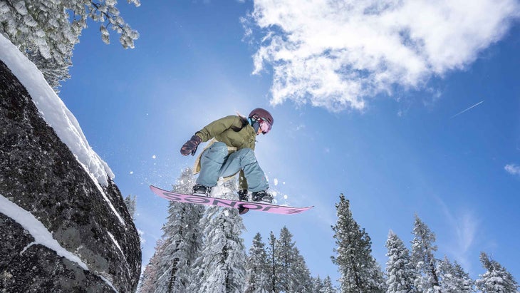 A woman snowboarding