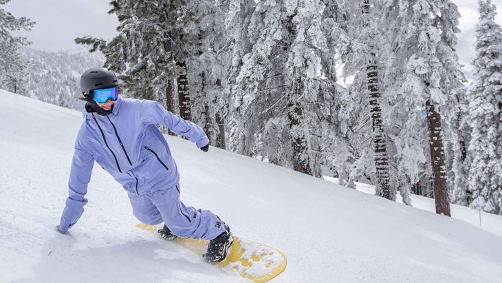 A woman snowboarding