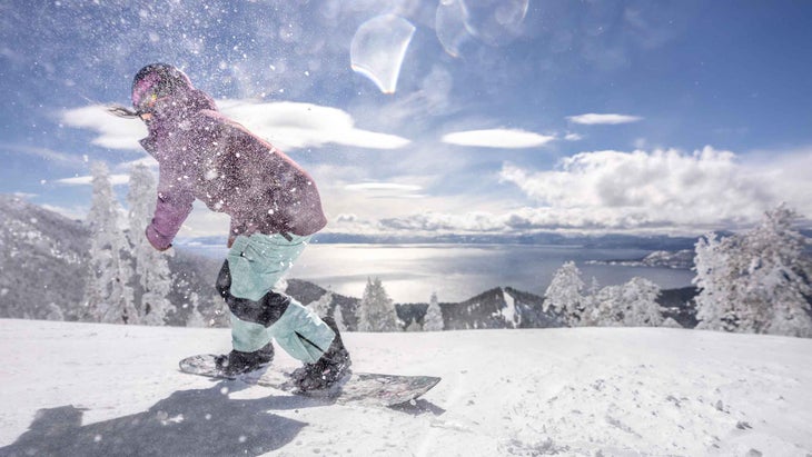 A woman snowboarding