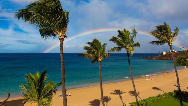 A rainbow above the golden sands of Maui's Kaanapali Beach