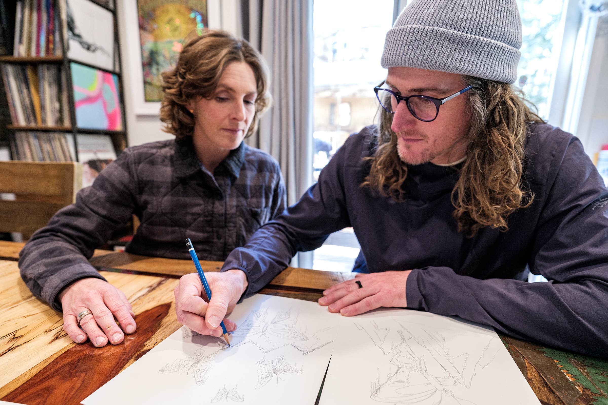 Chris sketching out ideas for a body-painting session. Once he finished, the whole family approved the results.