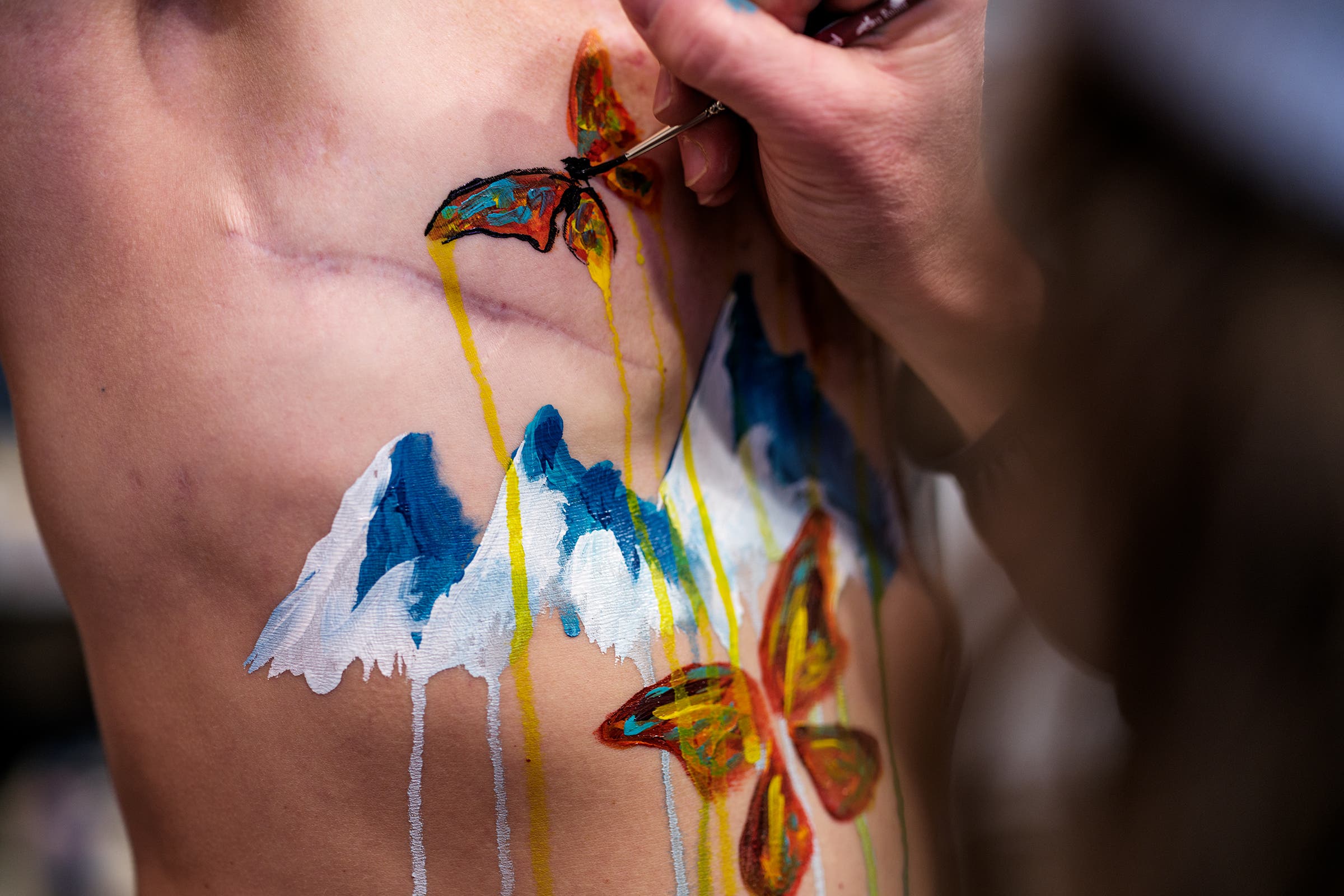 Chris and Kimmy during a body-painting session.