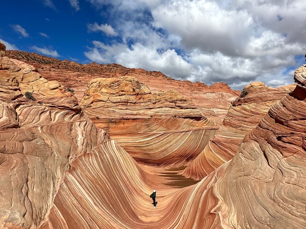 hiker on Coyote Buttes North The Wave trail, Arizona