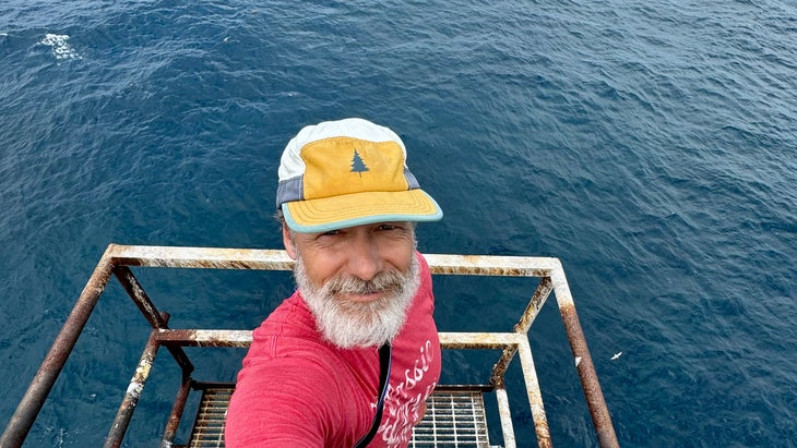 man on top of lighthouse