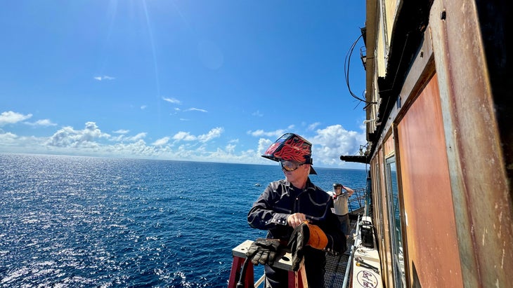 man repairing lighthouse