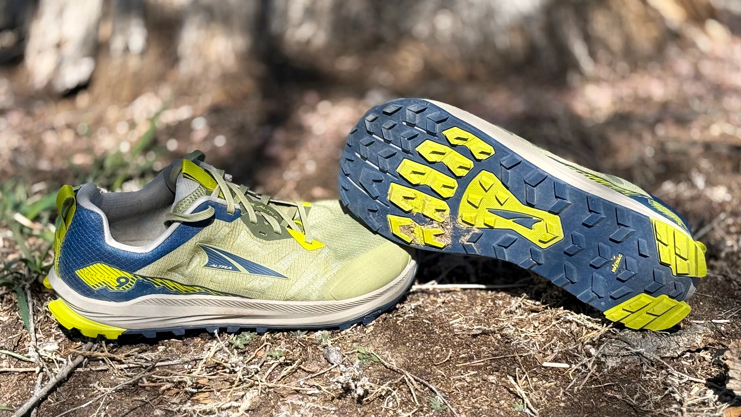 Yellow and navy blue Altra Lone Peak 9 trail running shoe tested on trail