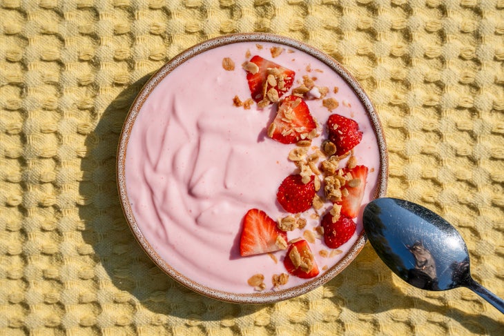 Yogurt with strawberries on top