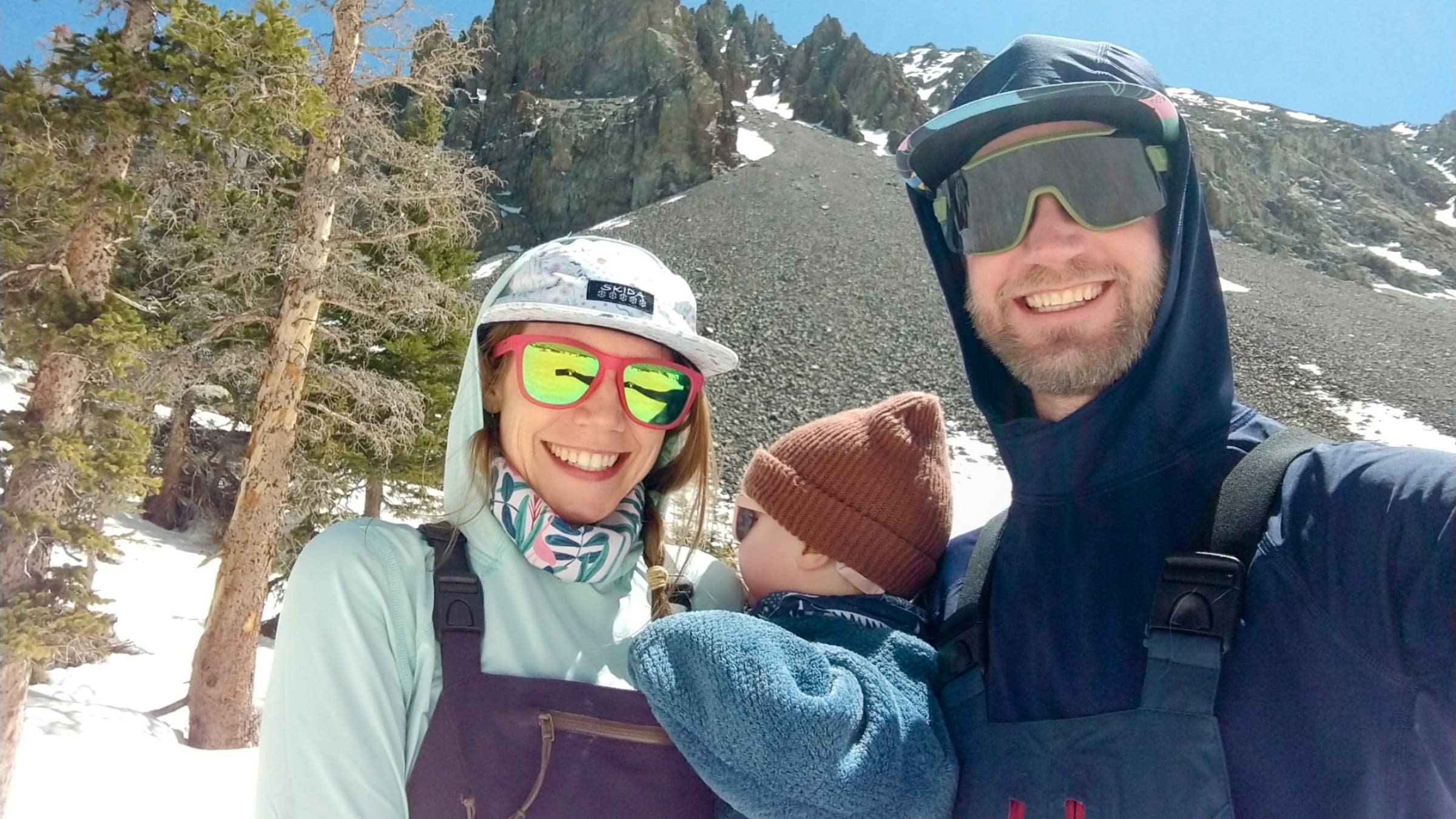 Lindsay Leoni Bourgoine and Ben Leoni with their son on a ski tour for Lindsay's first Mother's Day, in Colorado's Never Summer Range, May 2022.