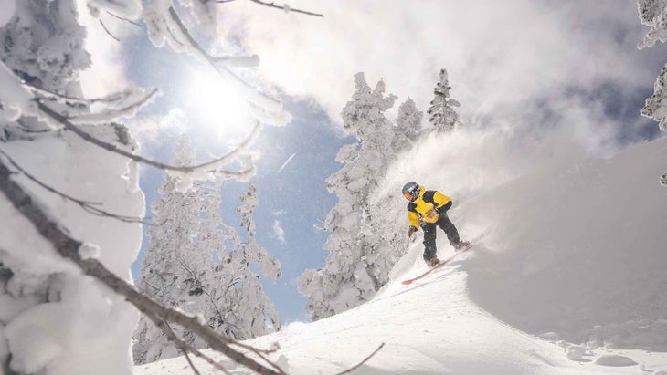 A man snowboarding