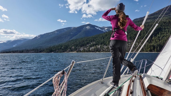 jayme moye sailing her boat on Kootenay Lake in nelson, british columbia