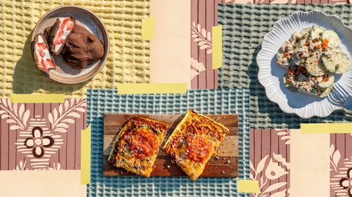 Three high-protein meals on plates laid out on a table.