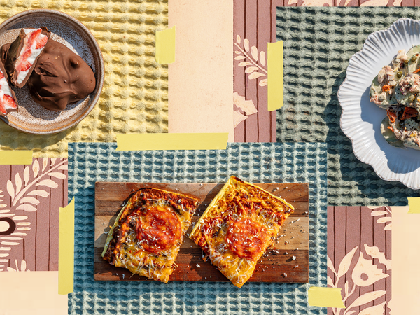 Three high-protein meals on plates laid out on a table.