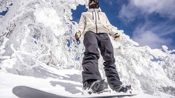 A woman snowboarding