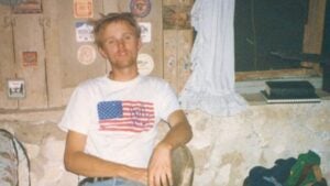 The author squatting in a cabin in Death Valley in 1998