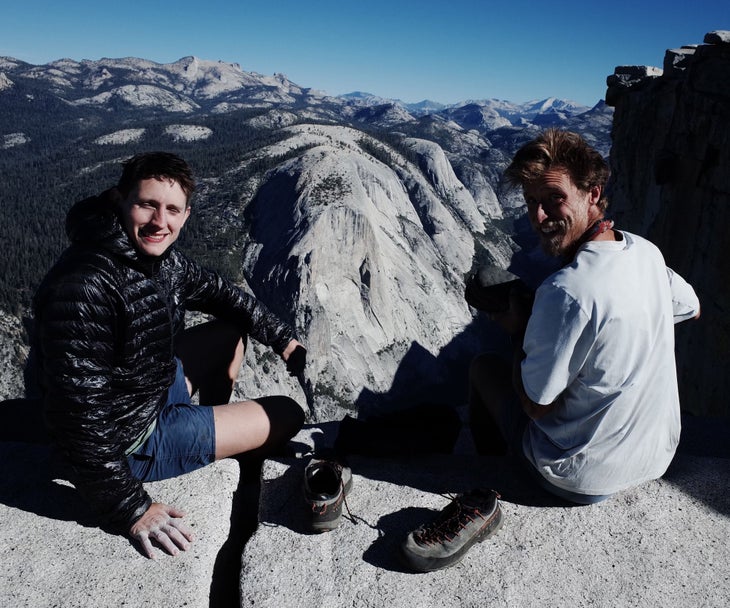 Two climbers on Half Dome celebrating their new speed record on the Yosemite Triple Crown.