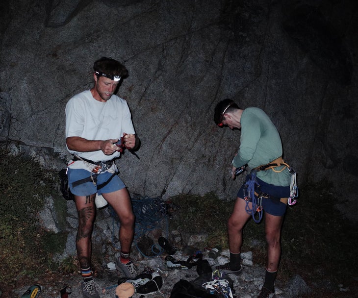 Two climbers gearing up to climb the Nose.