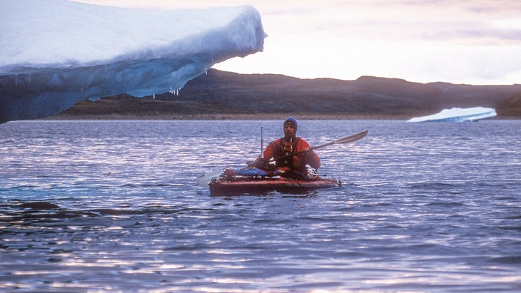 Jon Waterman kayaking among icebergs in the arctic 