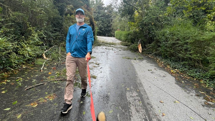 Graham Averill walks dog after hurricane