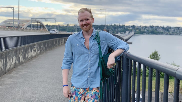 man walking on bridge