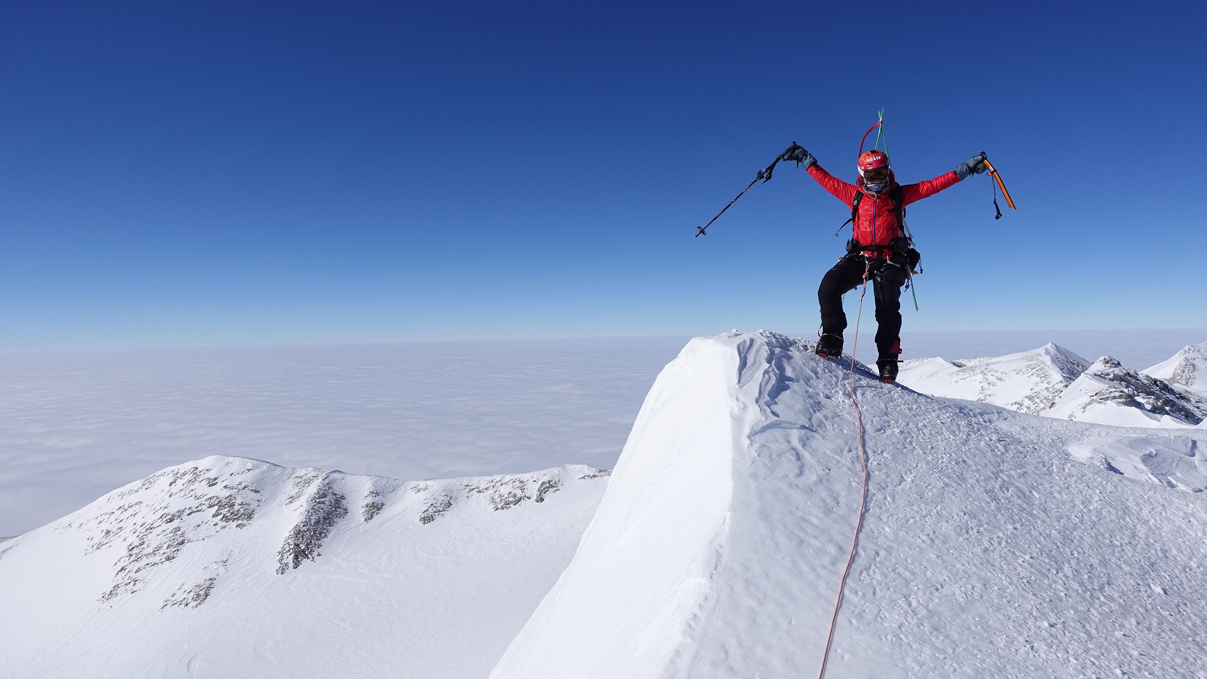 Celebrating on the summit of Mt. Vinson, the highest peak in Antarctica.