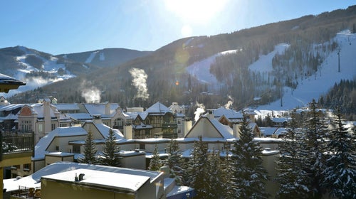 Buildings and ski runs at Vail Resorts in Vail Colorado on a sunny day