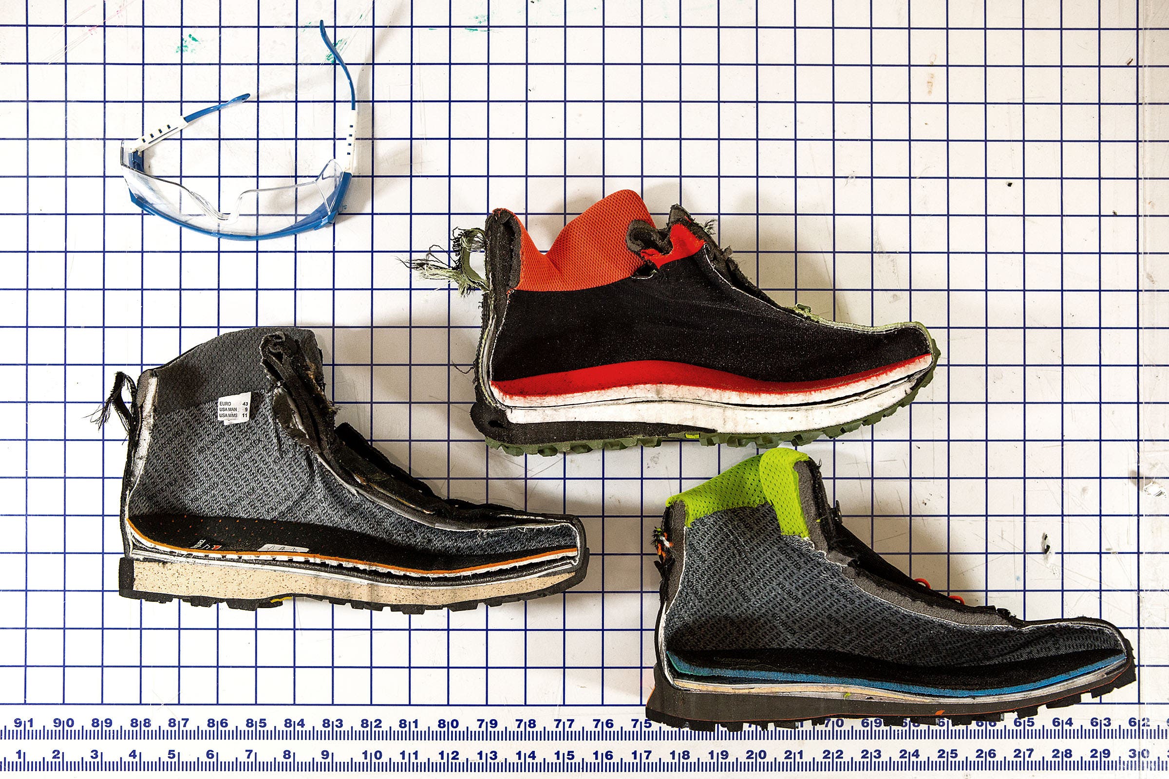 Hiking boots are cut in half with a bandsaw after testing so researchers can measure midsole compression