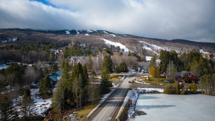 A view of Vermont’s Mount Snow ski resort, with clouds covering the top of the mountain.