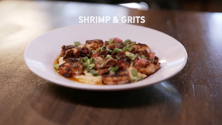 shrimp and grits on a white plate