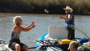 Tossing a beer from one river raft to another