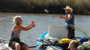 Tossing a beer from one river raft to another