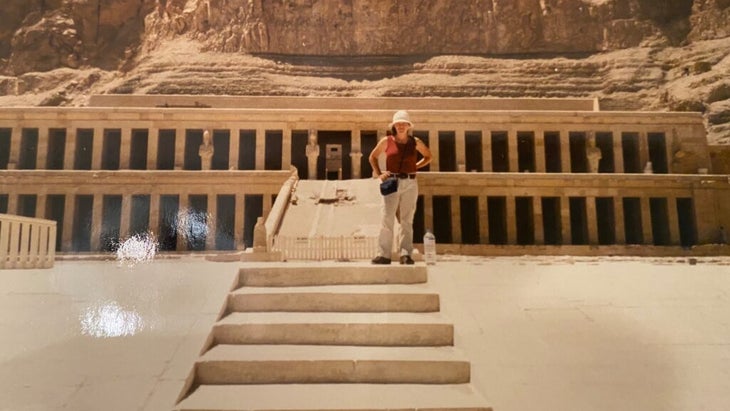 Tasha Zemke standing on the steps of the Temple of Hatshepsut in Egypt