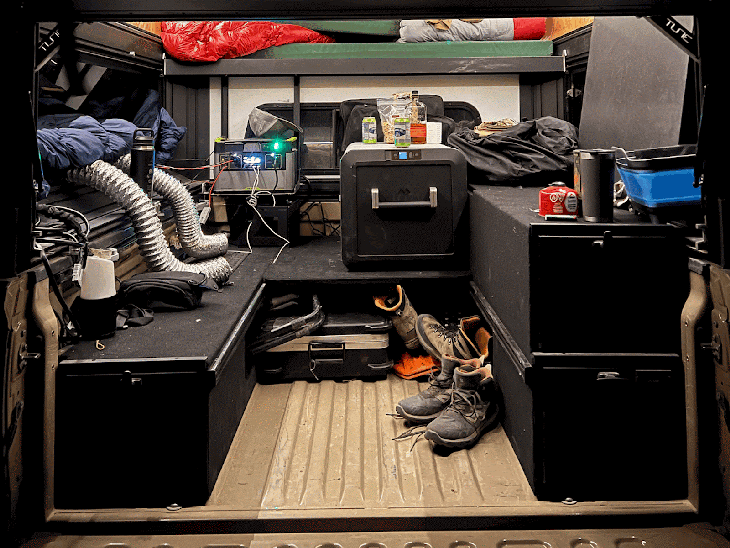 Basecamp custom storage drawers in a truck bed with camper top