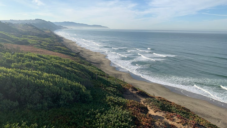 hiker looking out from San Francisco seascape