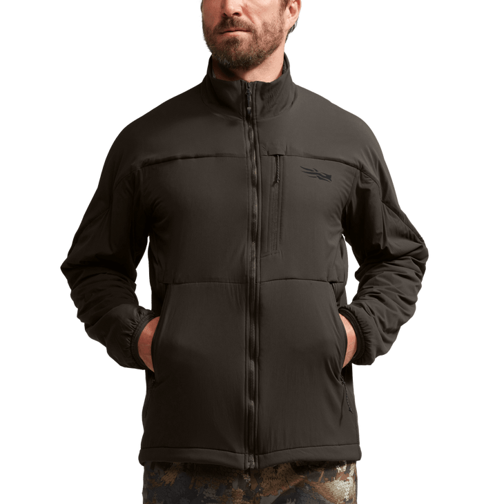 A model dons the Sitka Ambient 200 jacket.