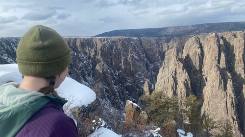 woman standing along black canyon hikes
