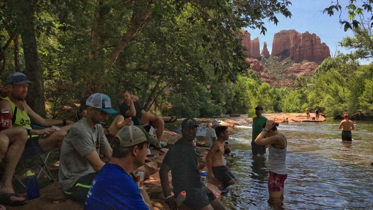 sedona locals drinking beers by the river