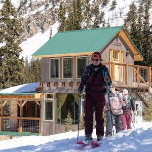 women skiing outside of raven's nest: the coolest airbnb in colorado