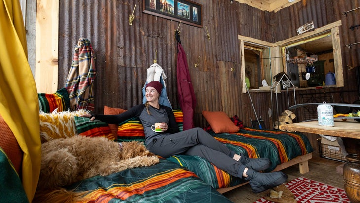 raven's nest living room and girl relaxing with hot chocolate