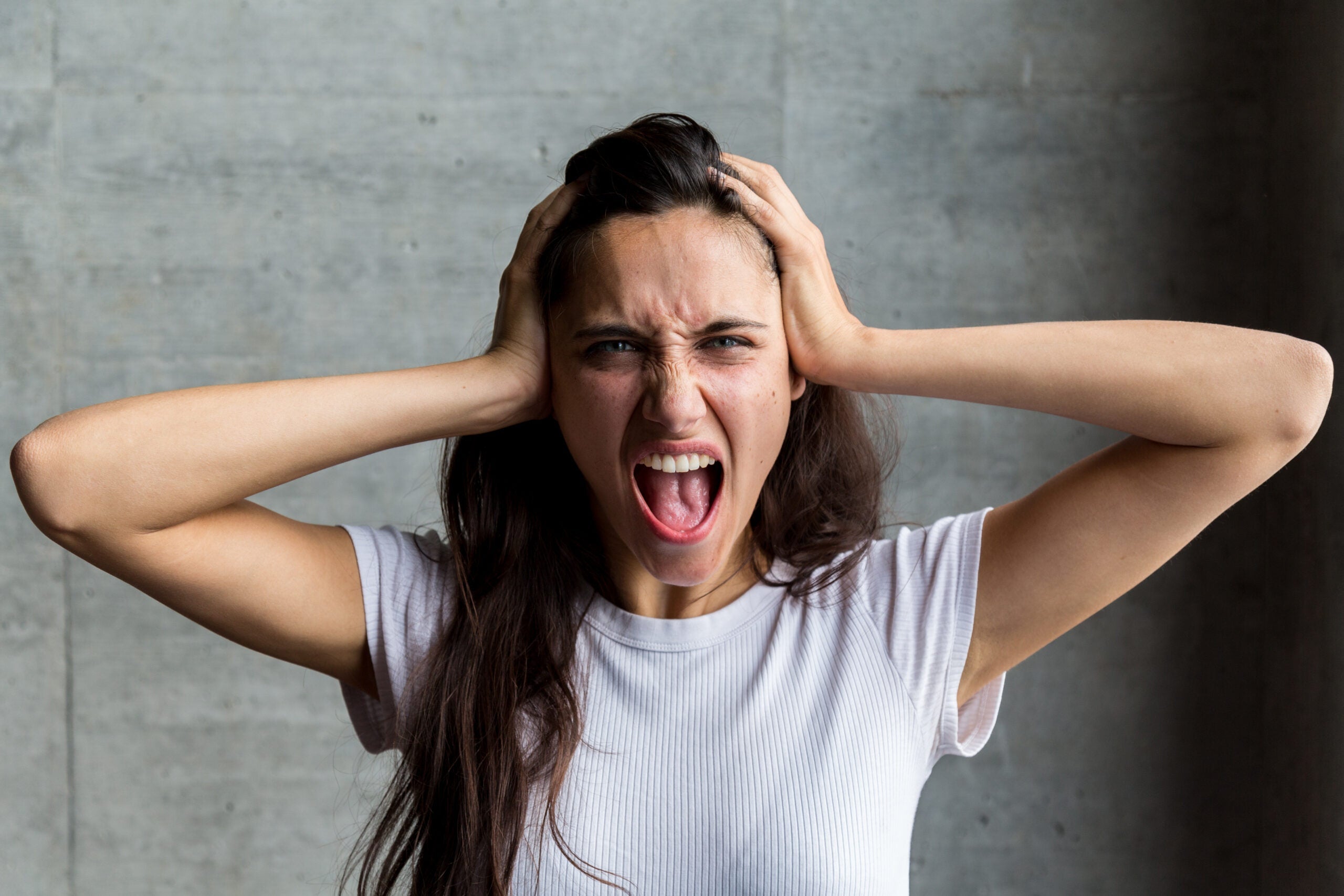 Woman screaming because she is not having a stress-free Thanksgiving