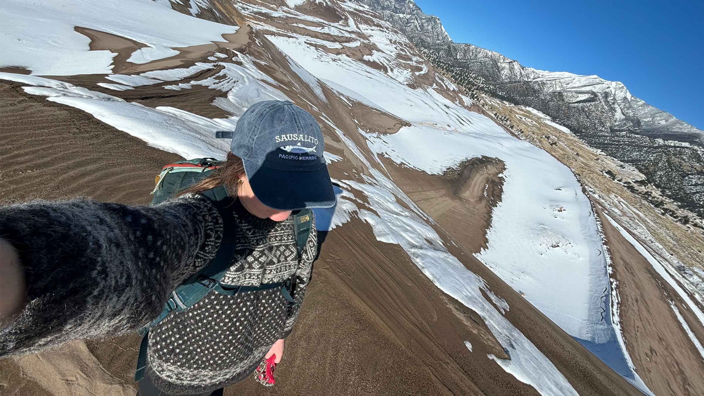A woman hiking in Great Sand Dunes National Park
