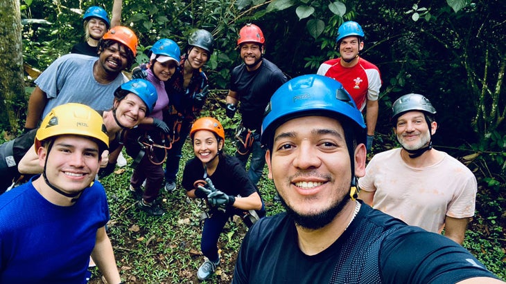 Global Glimpse workers wearing climbing helmets