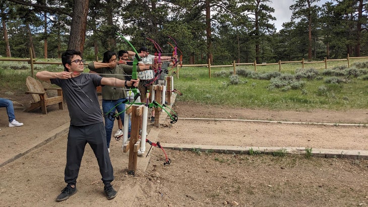 Optera workers doing archery